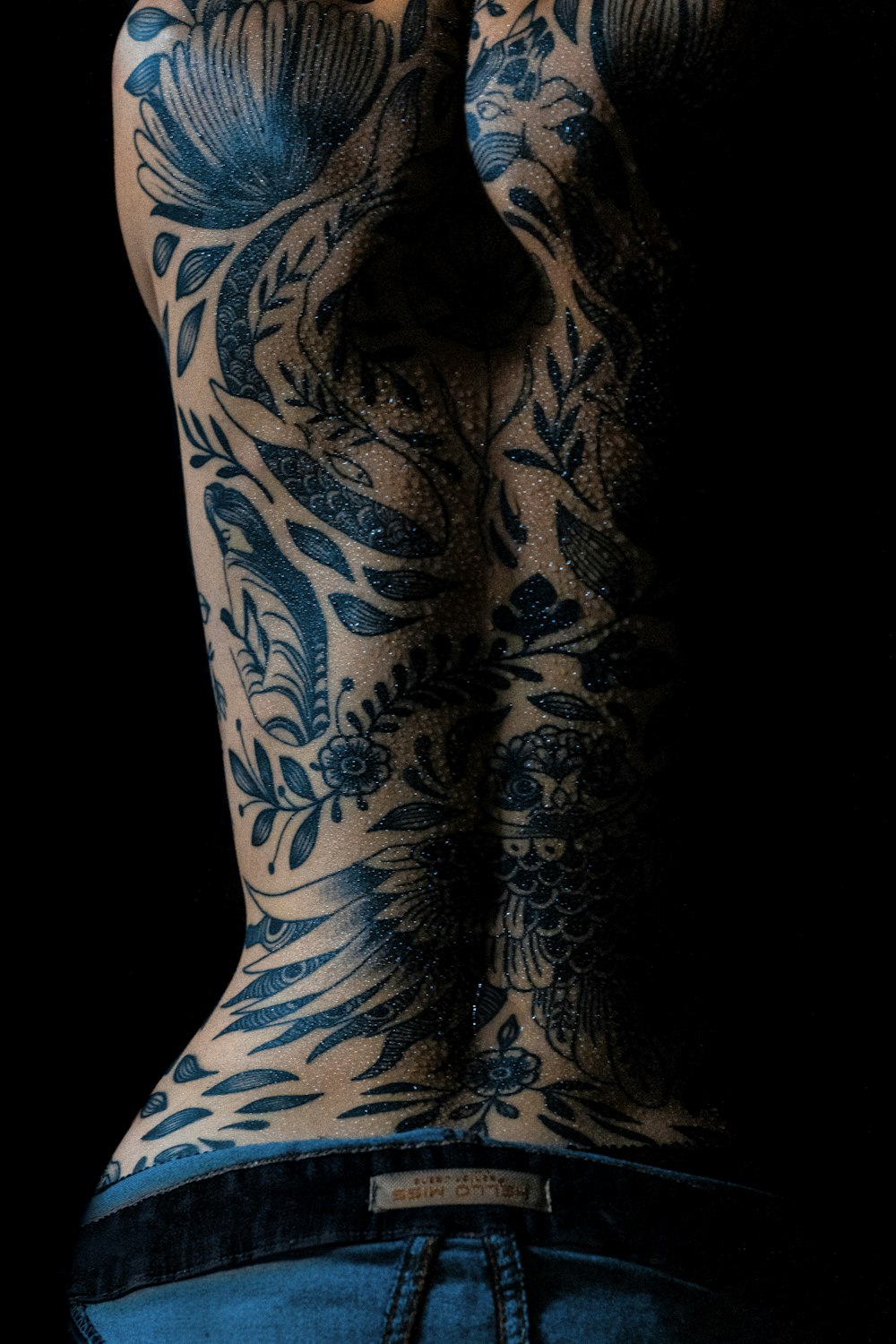 a person's leg with tattoos