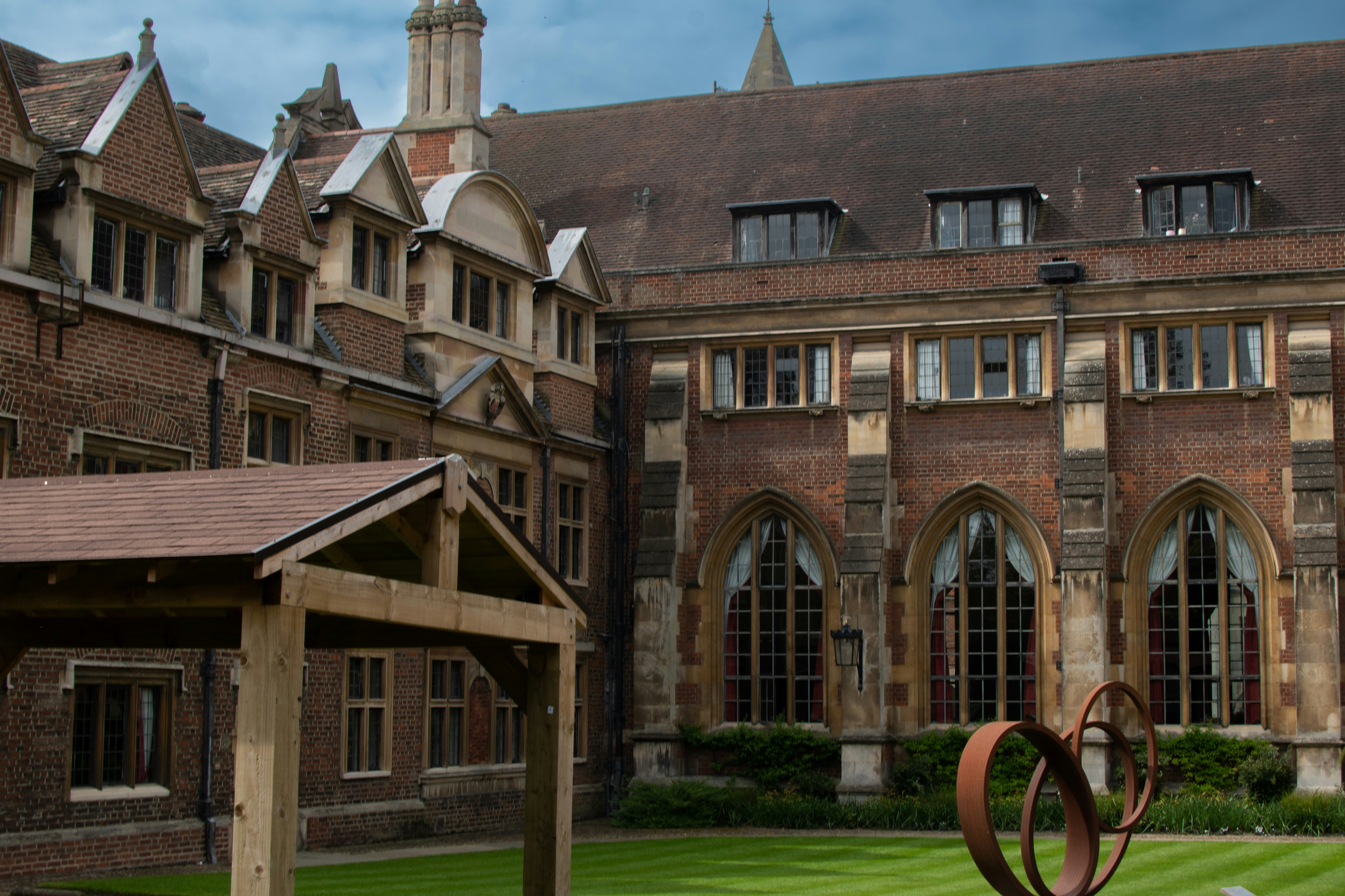 a brick building with a fence in front of it
