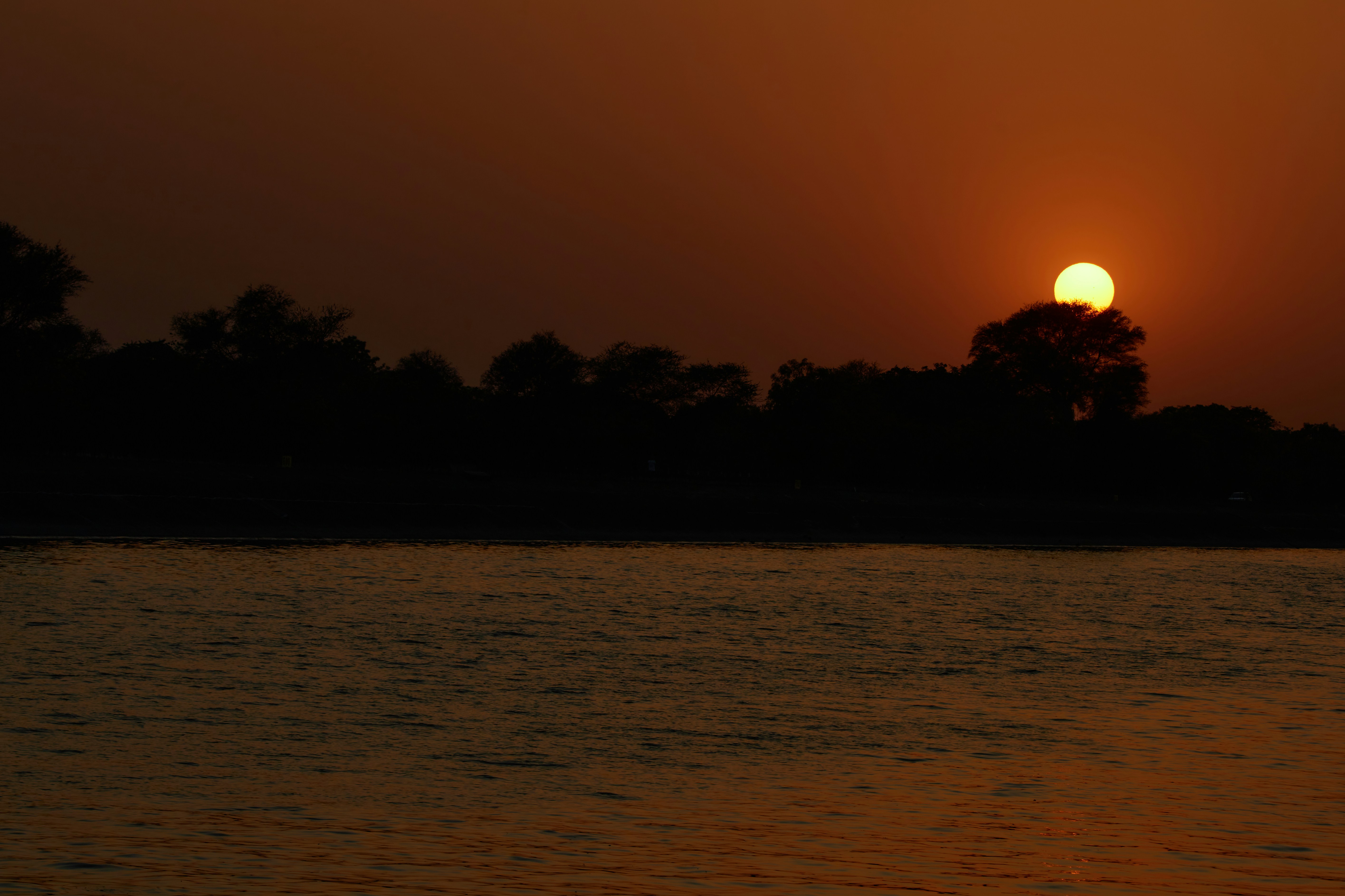 a sunset over a lake