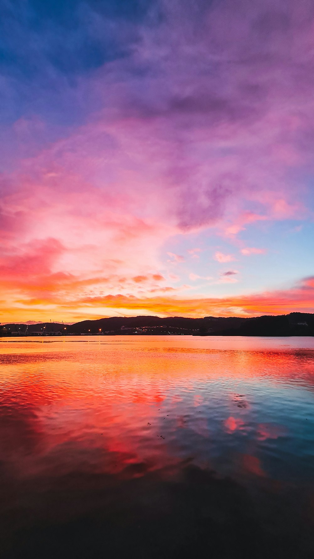 a sunset over a lake