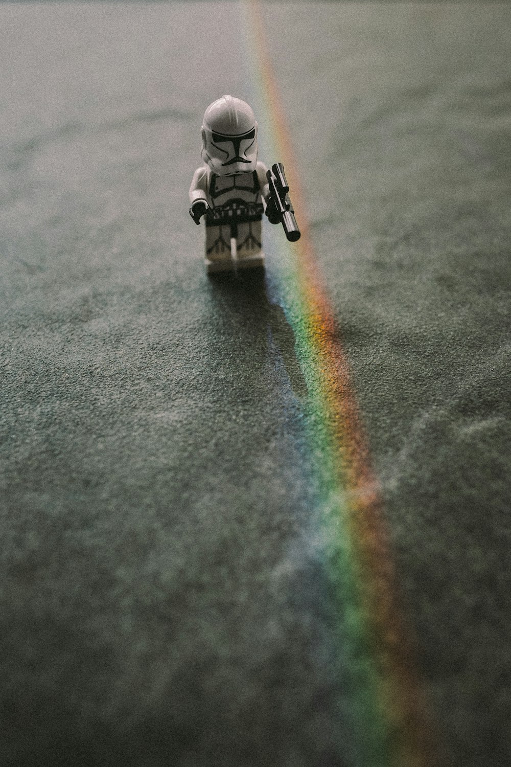 a toy astronaut with a rainbow