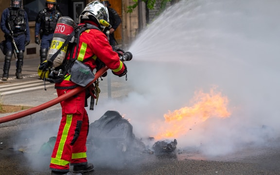 a firefighter putting out a fire