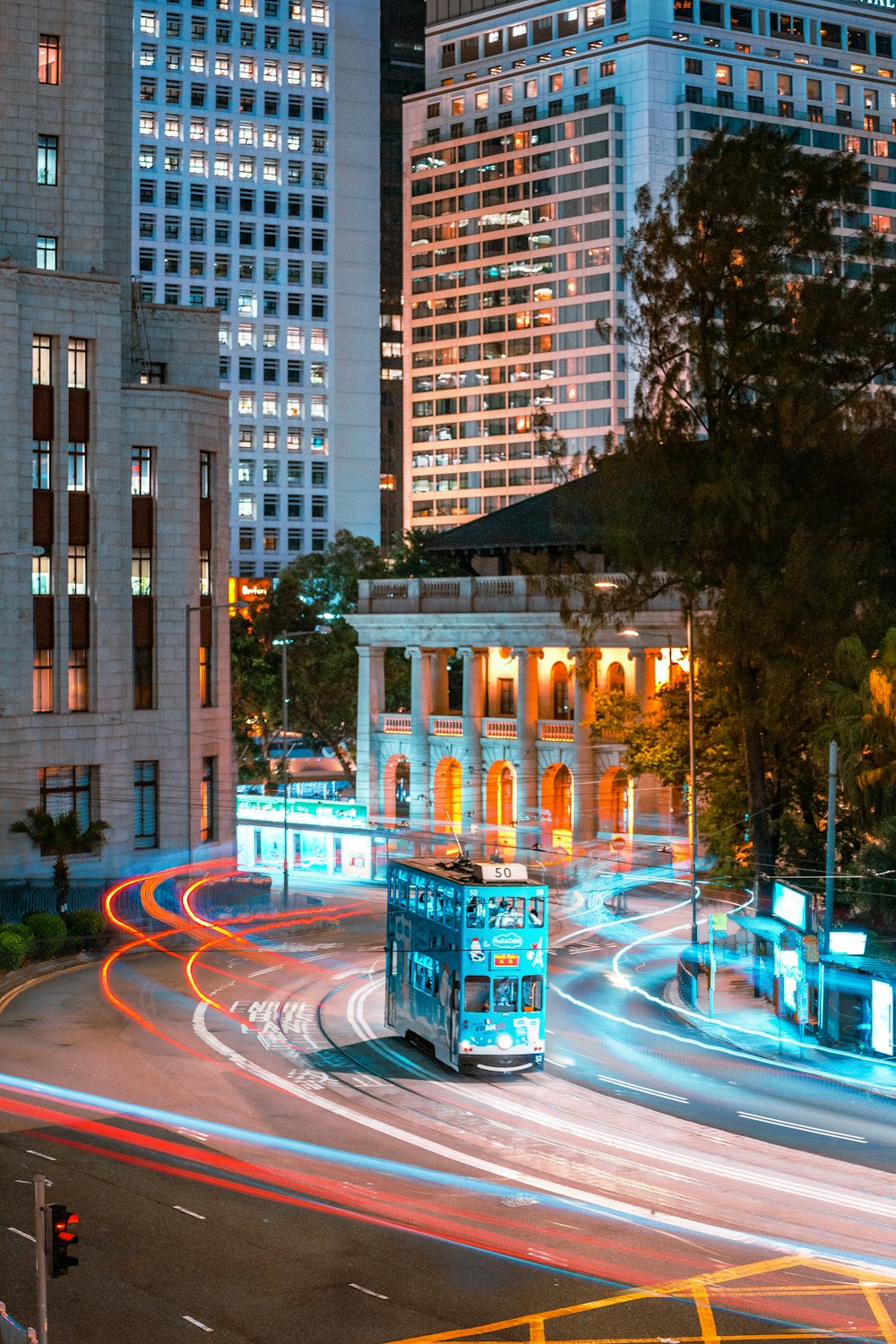 a double decker bus driving through a city