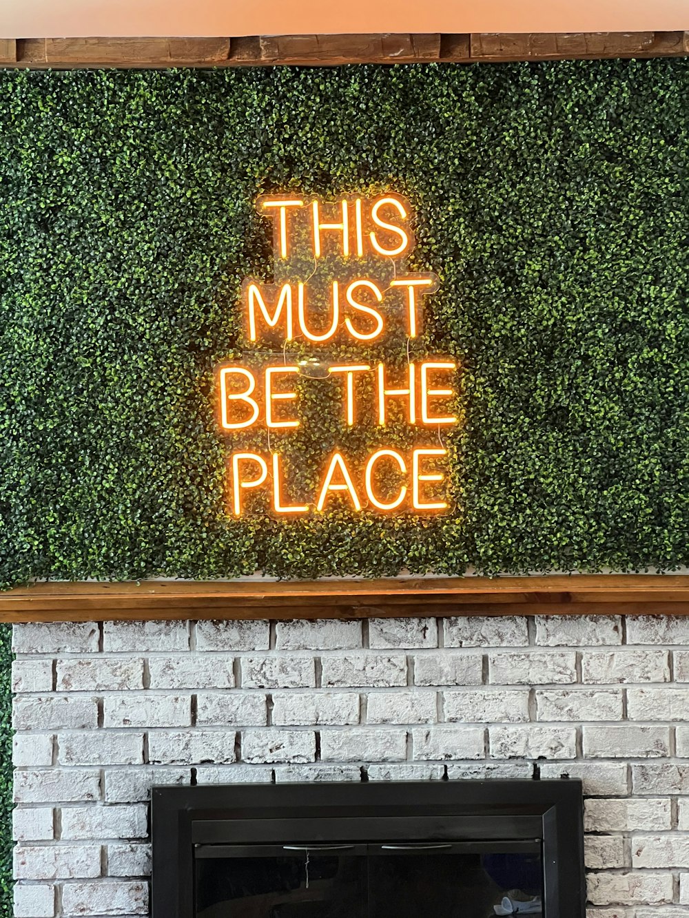 a sign on a brick wall