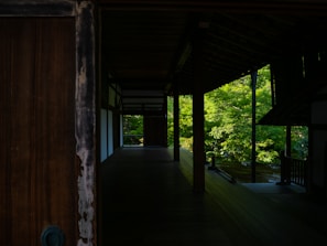 A beautifully landscaped garden with deep green foliage and warm brown wooden accents.