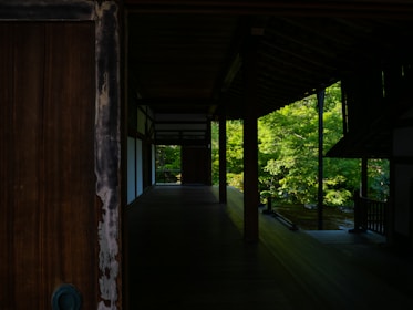 A beautifully landscaped garden with deep green foliage and warm brown wooden accents.