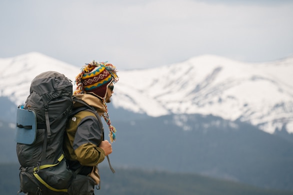 a person with a backpack on a mountain