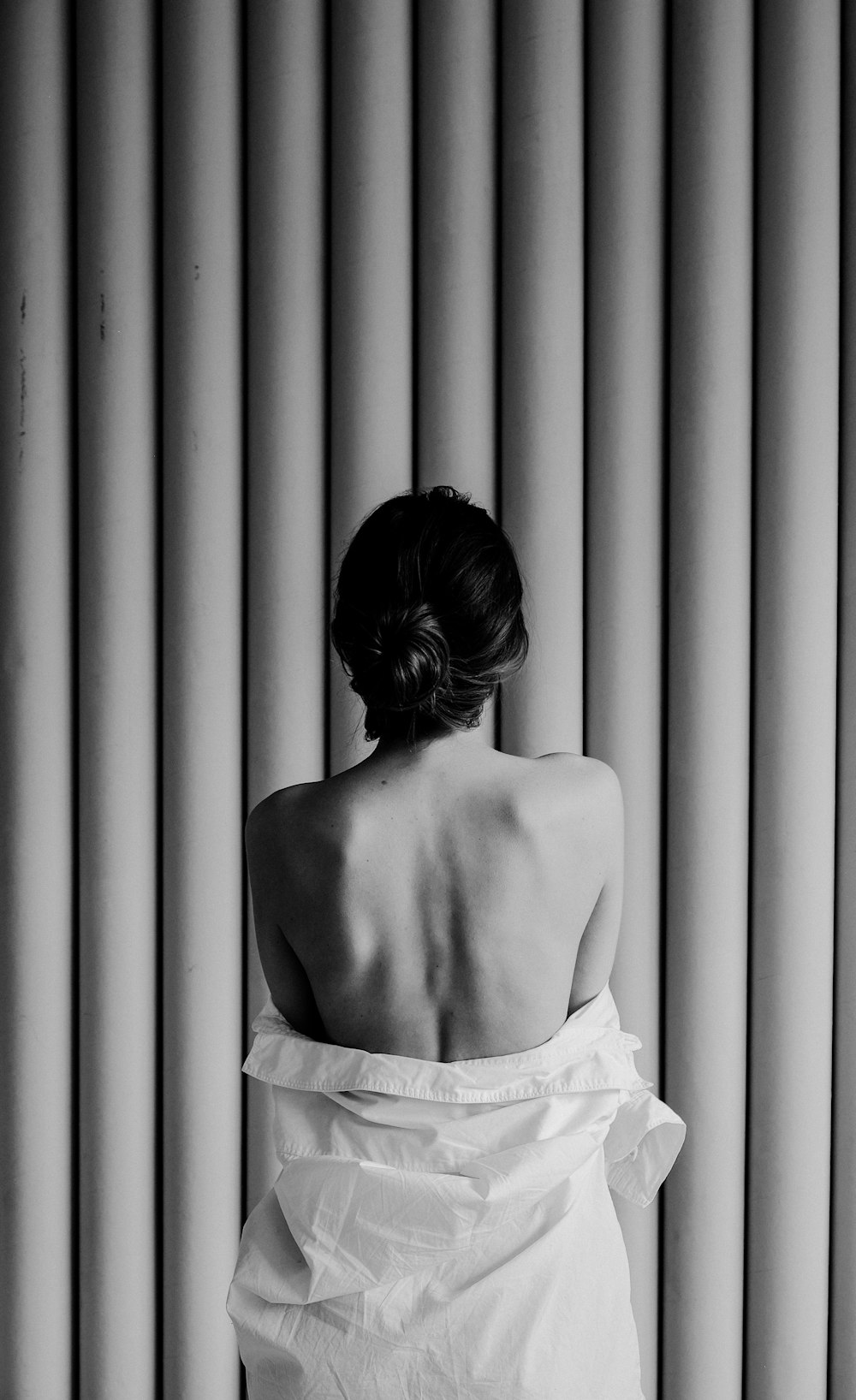 back of a person in a white dress