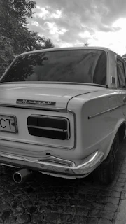 a car parked on a brick road