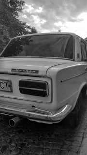 a car parked on a brick road