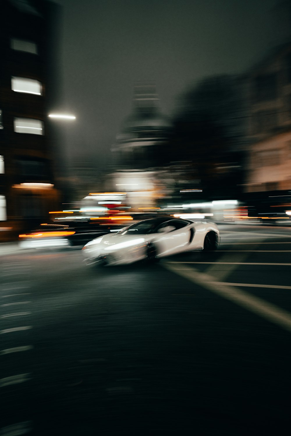 a car driving on a road at night