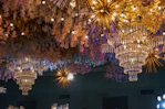 a group of chandeliers from a ceiling