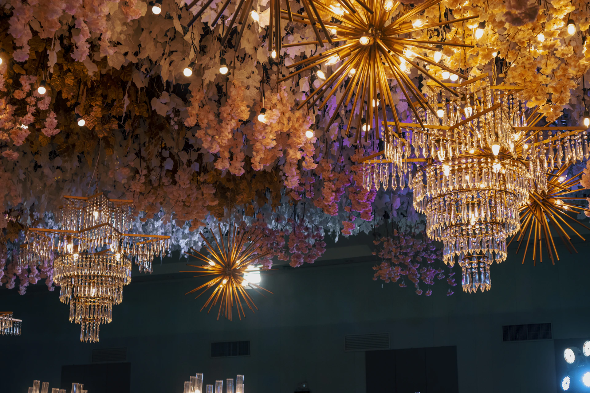 a group of chandeliers from a ceiling
