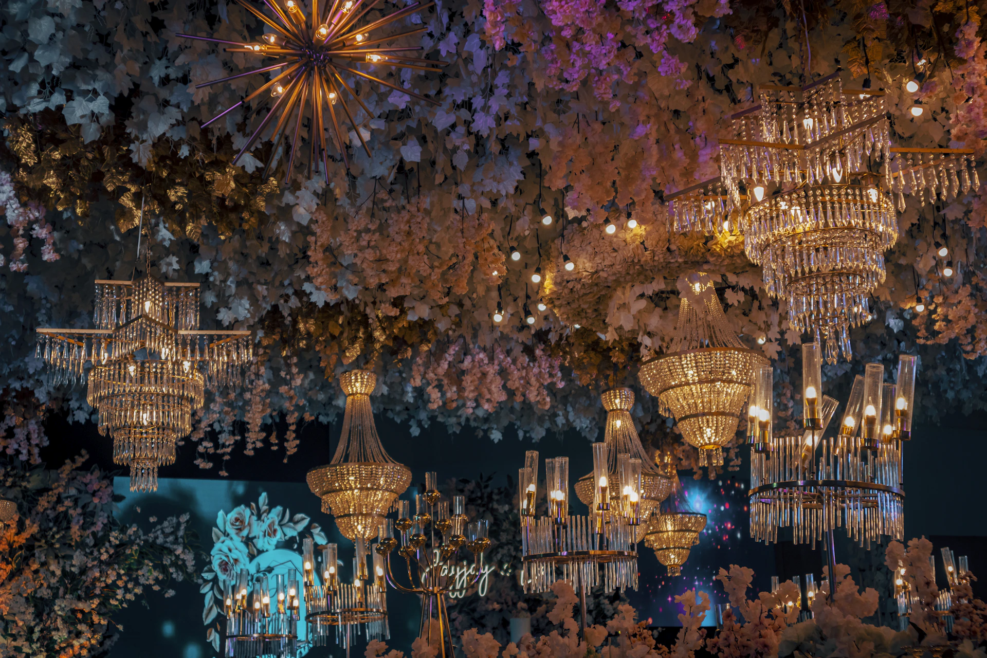a building with chandeliers and flowers on the ceiling