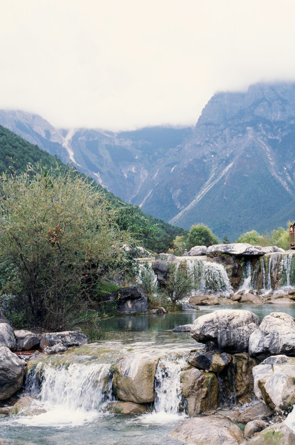 a river with rocks and trees