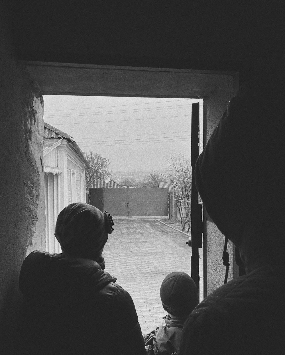 a group of people looking out a window