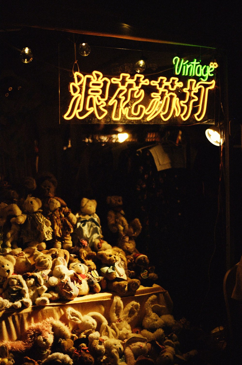 a group of teddy bears sit in a store