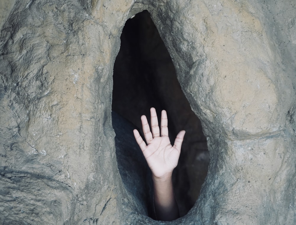a hand in a cave