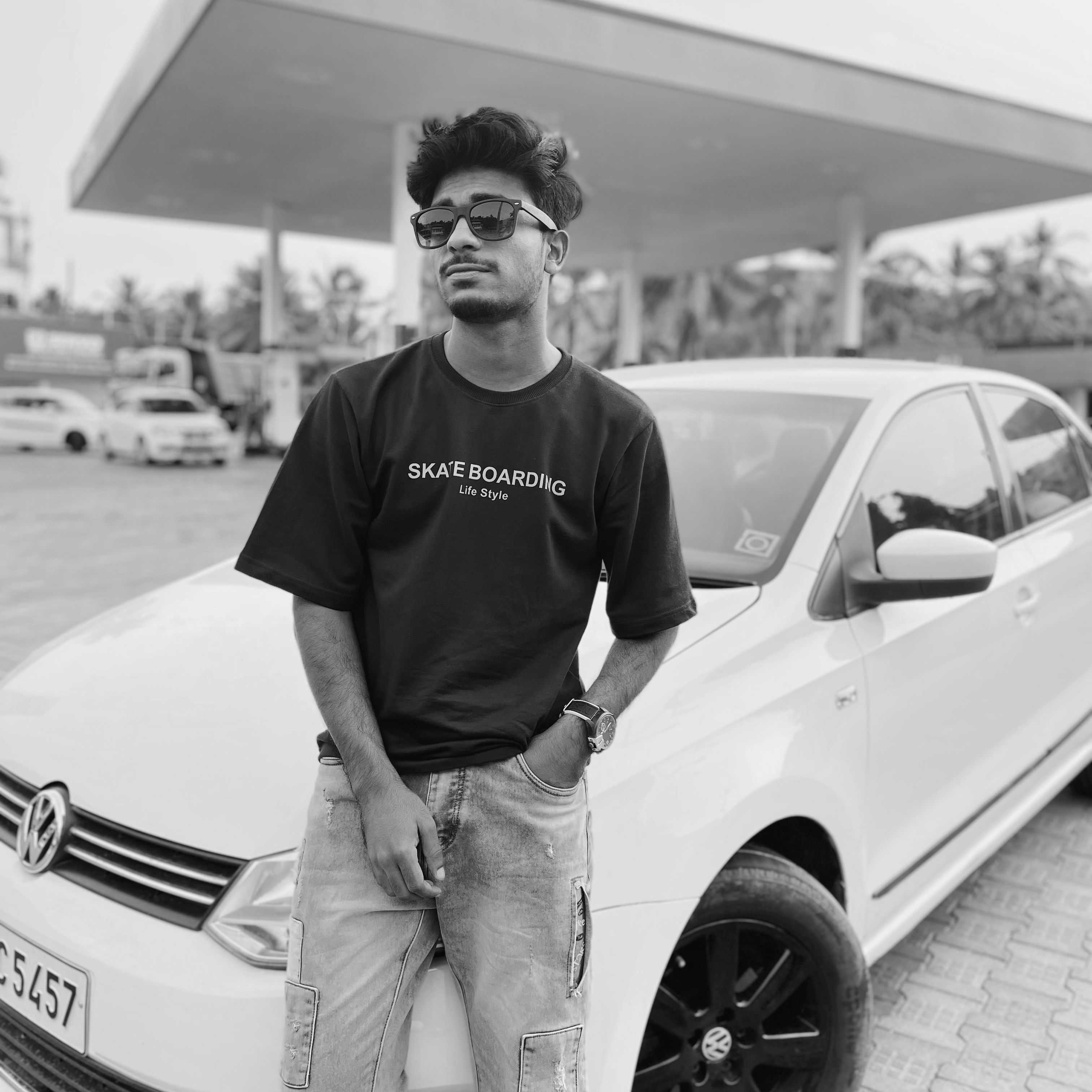 a man standing next to a car
