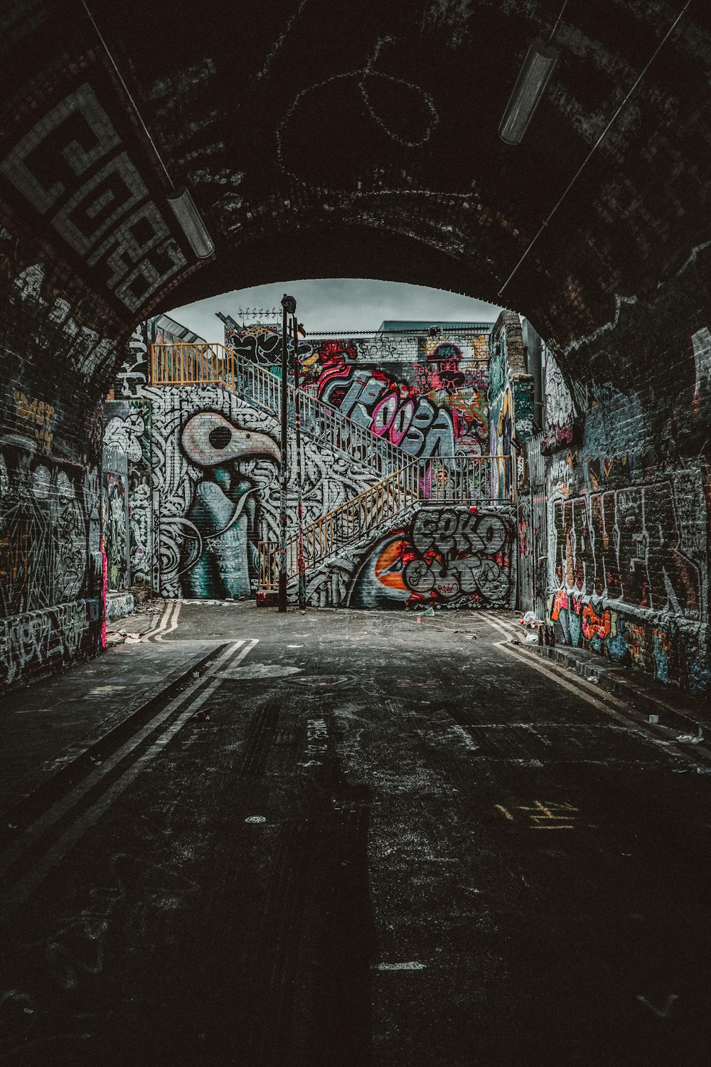 a tunnel with graffiti