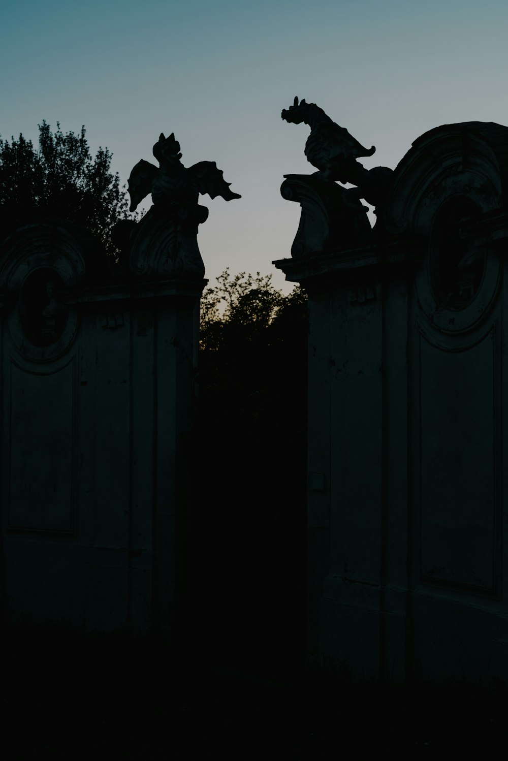 a statue on a fence