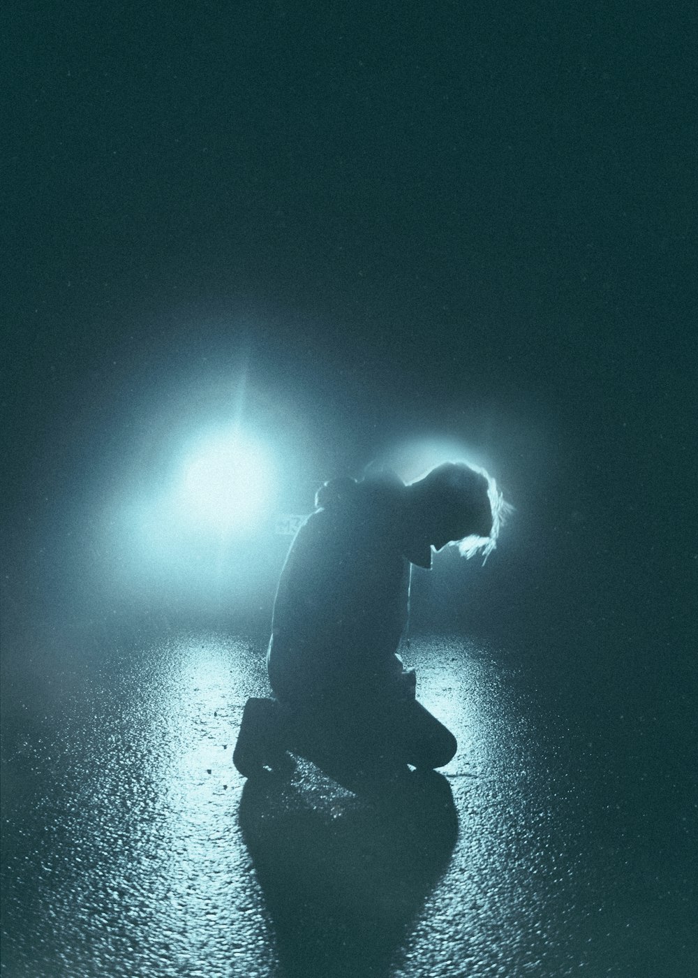 a person kneeling in the water