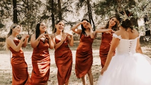 a group of women in dresses