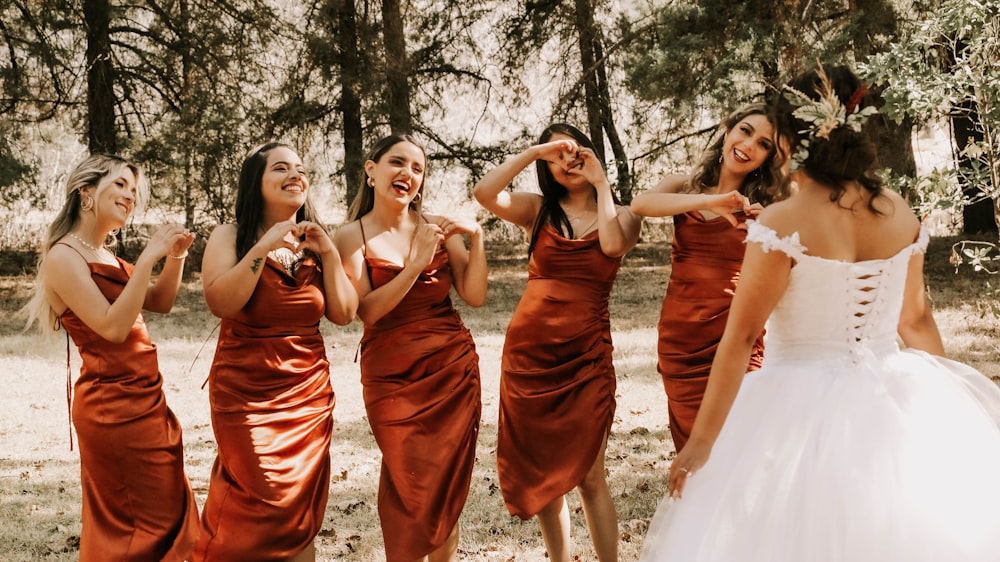 a group of women in dresses