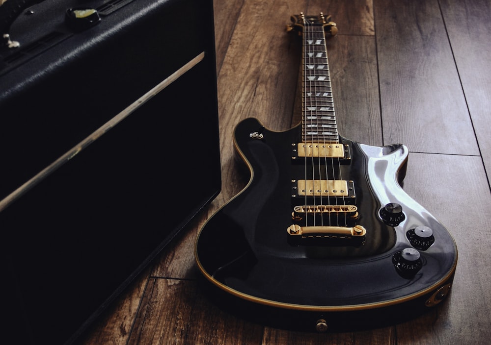 a black and yellow electric guitar