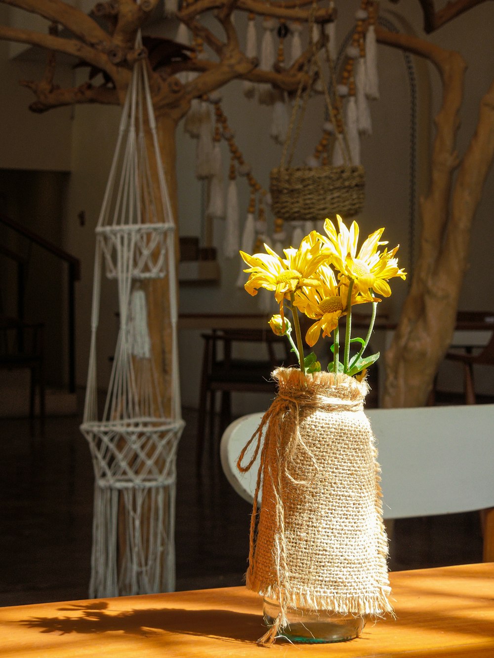 a vase with yellow flowers