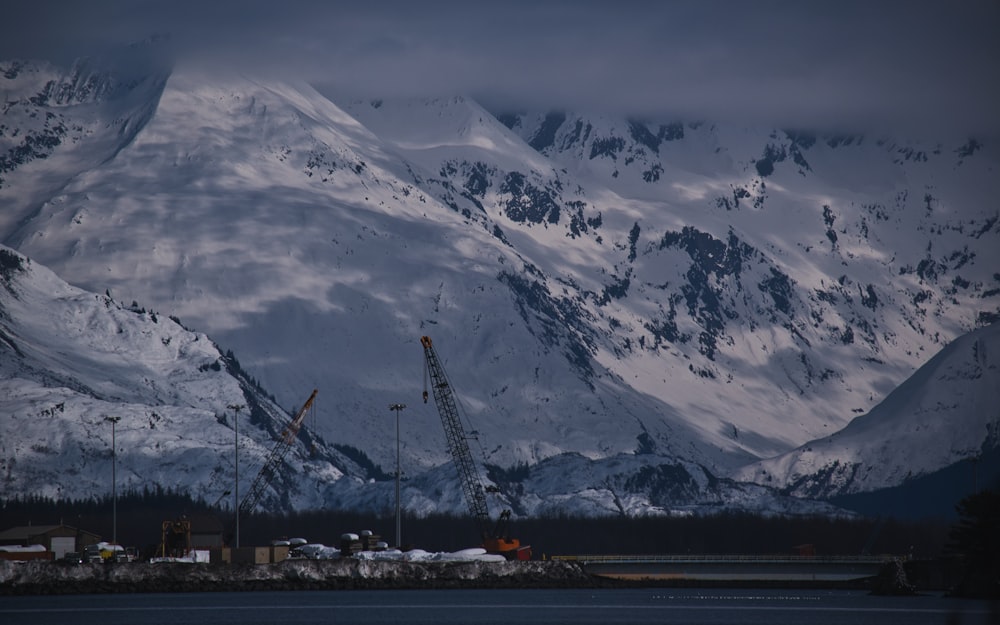 a snowy mountain with a crane