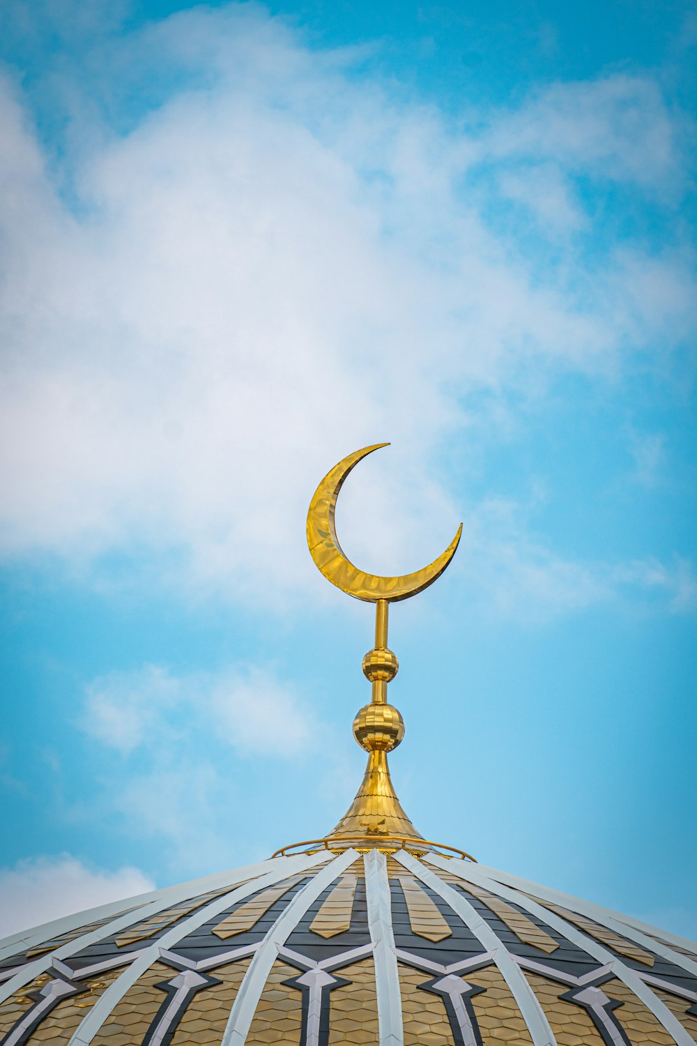 a gold statue on top of a building