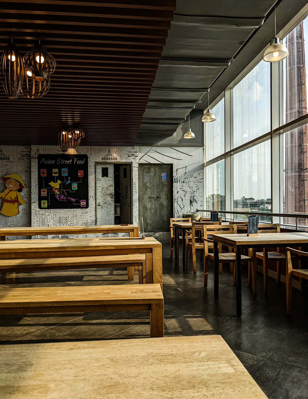 a room with tables and benches