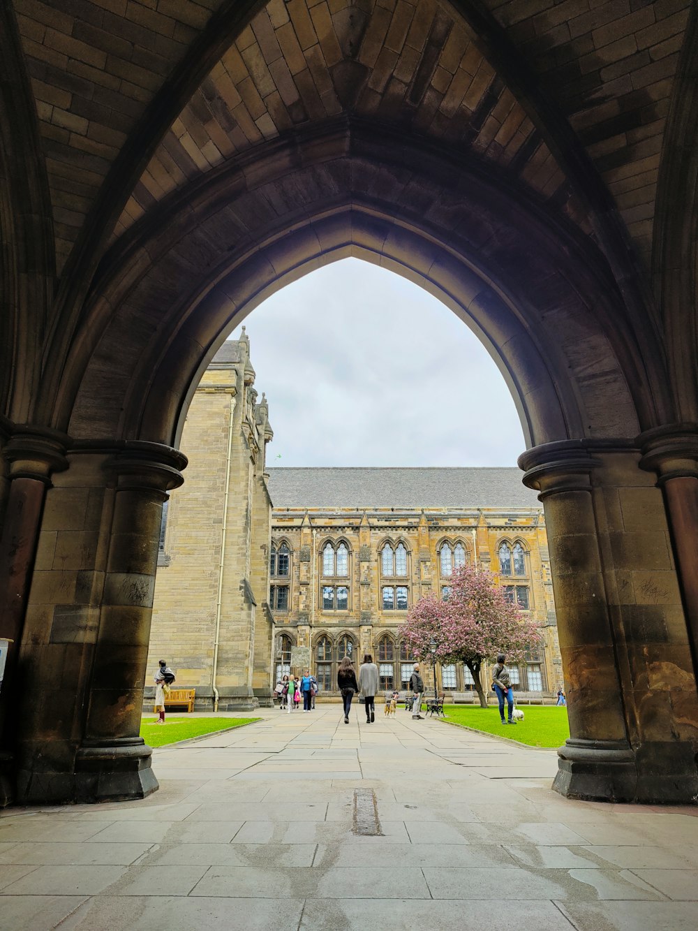 a group of people walking through a building