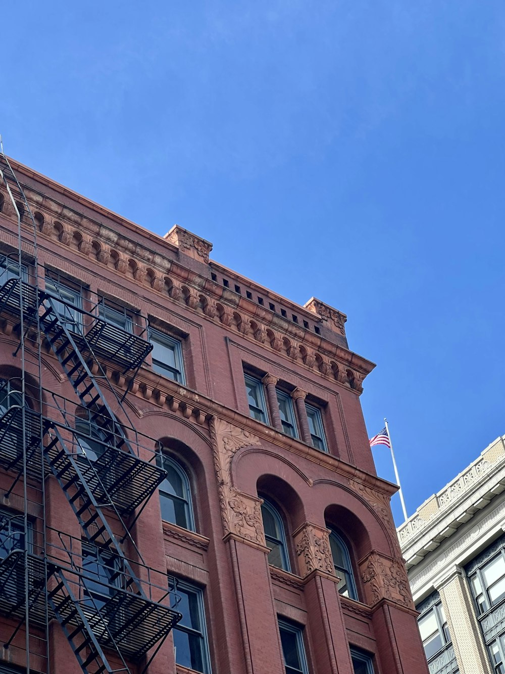 a building with balconies and a blue sky