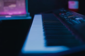 A sleek digital keyboard with illuminated keys ready for a lesson.
