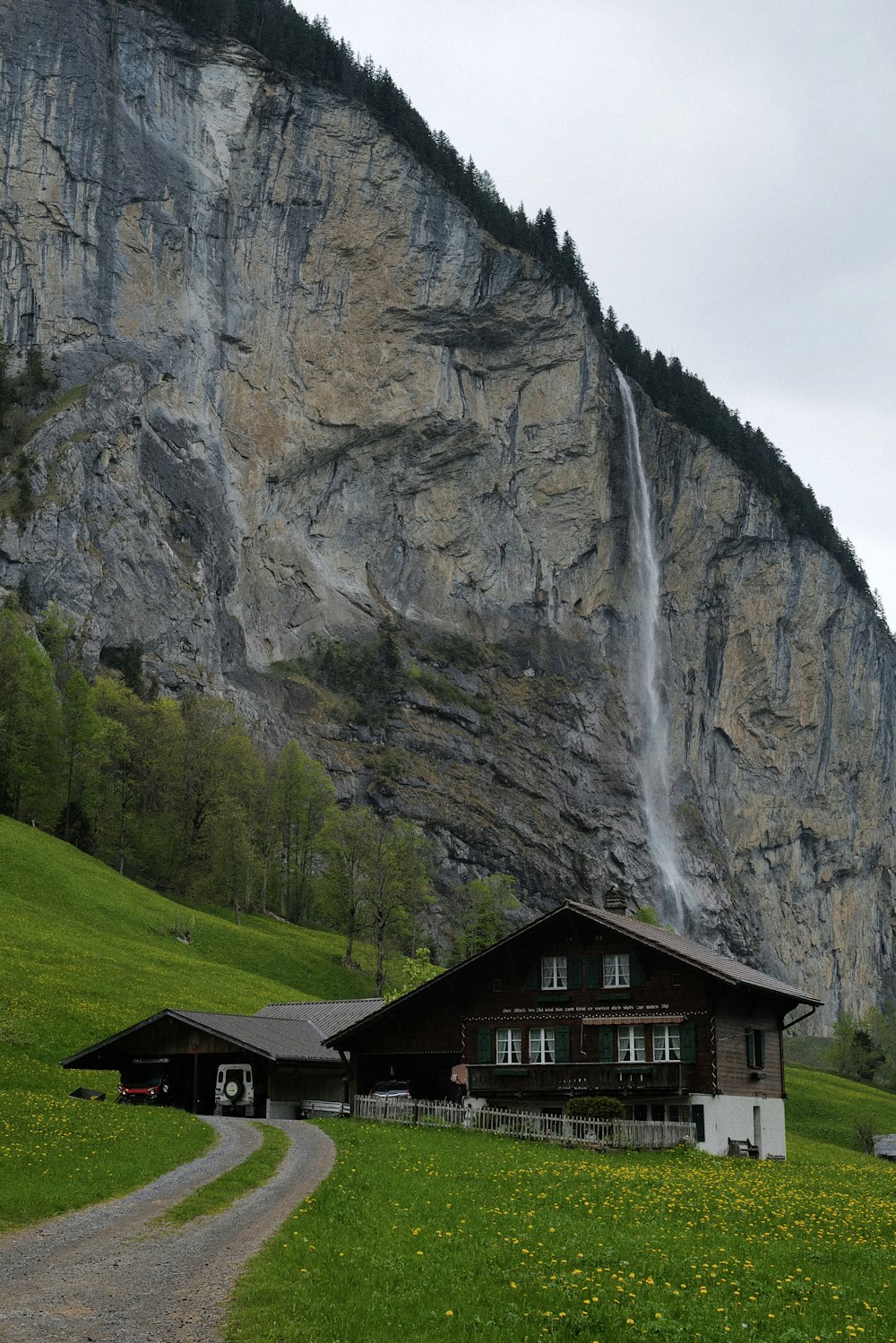 a house in front of a cliff