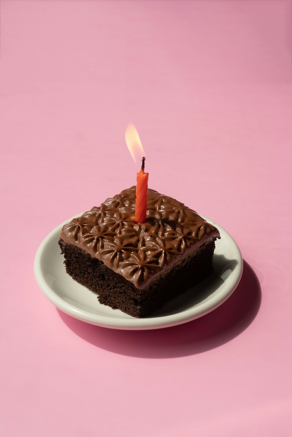 a chocolate cake with candles