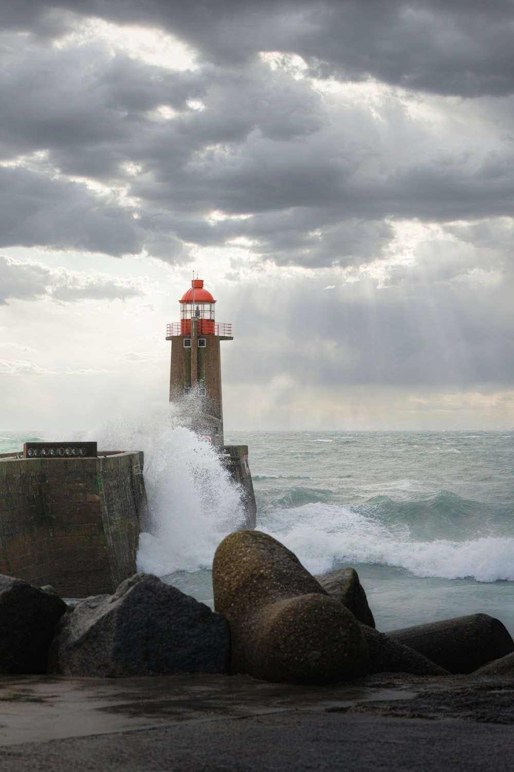 a lighthouse on a rocky beach