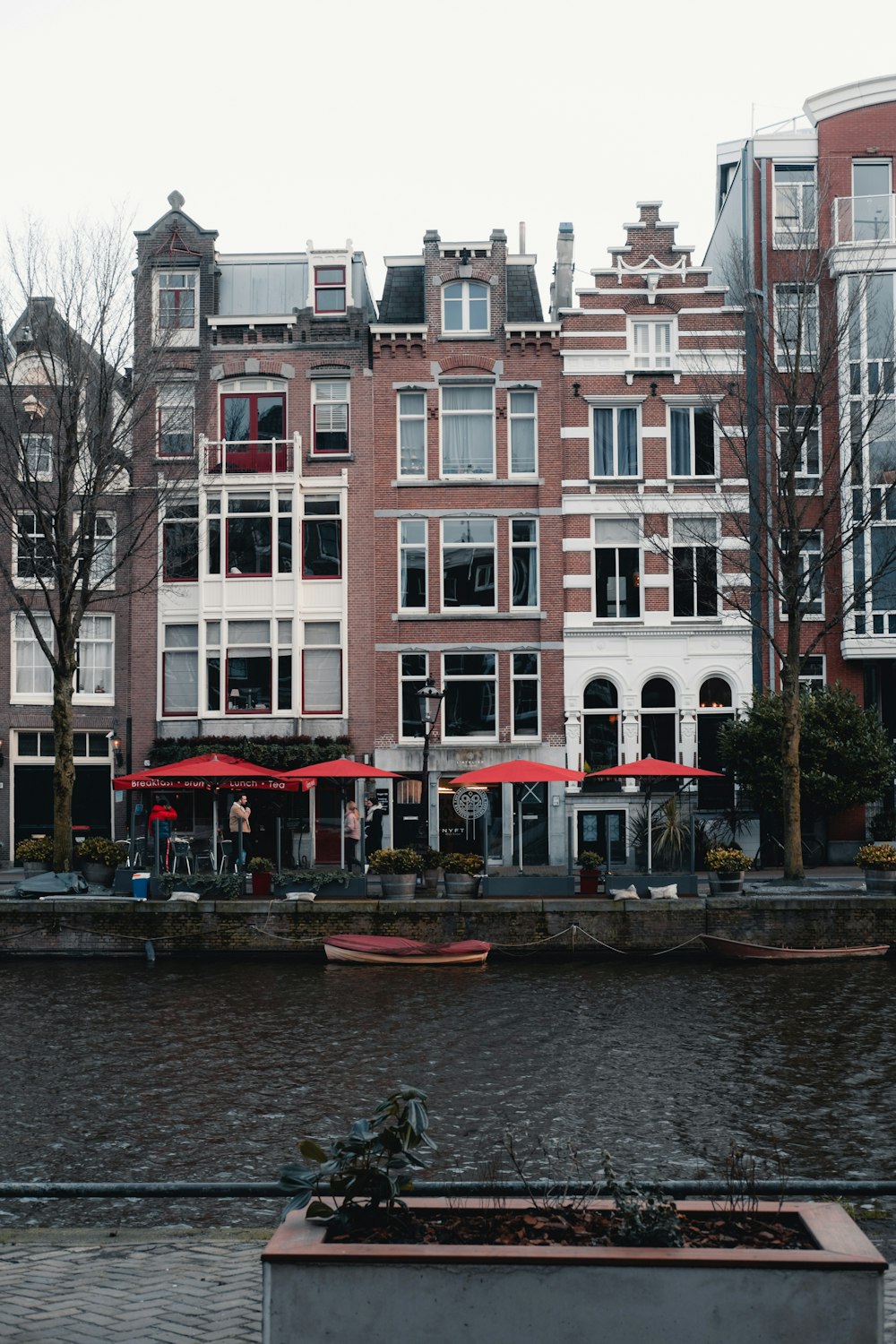 a row of buildings with boats