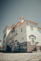Colorful Talavera tiles decorating a traditional Puebla building exterior.