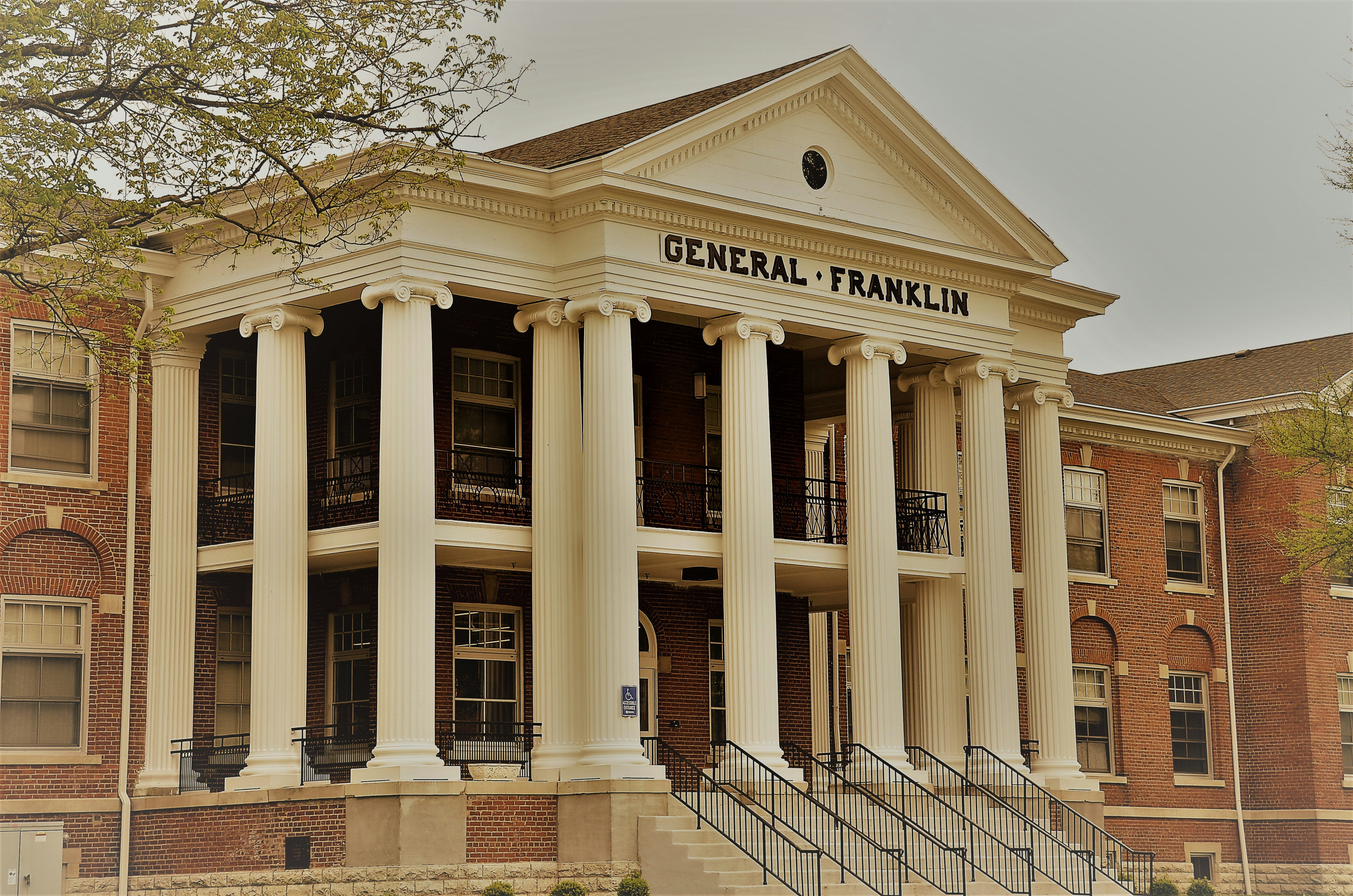 a building with columns and a staircase