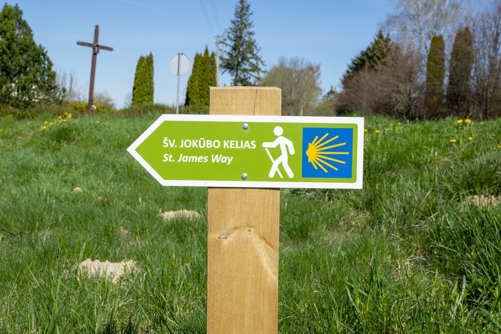 a sign in a grassy field