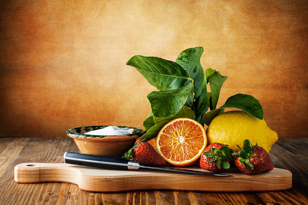 a plate of fruit and a bowl of soup