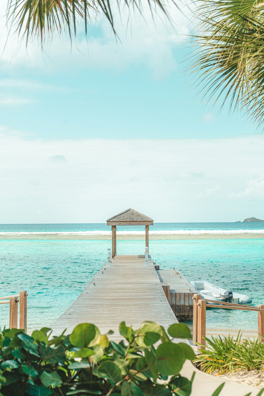 a dock leading to a beach