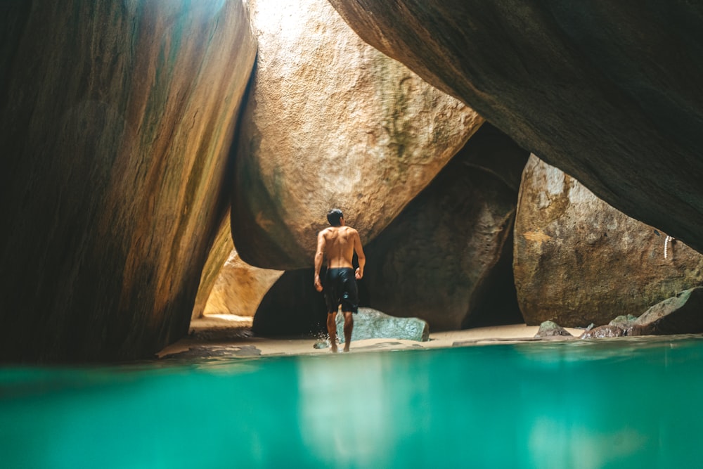 a person standing in a cave