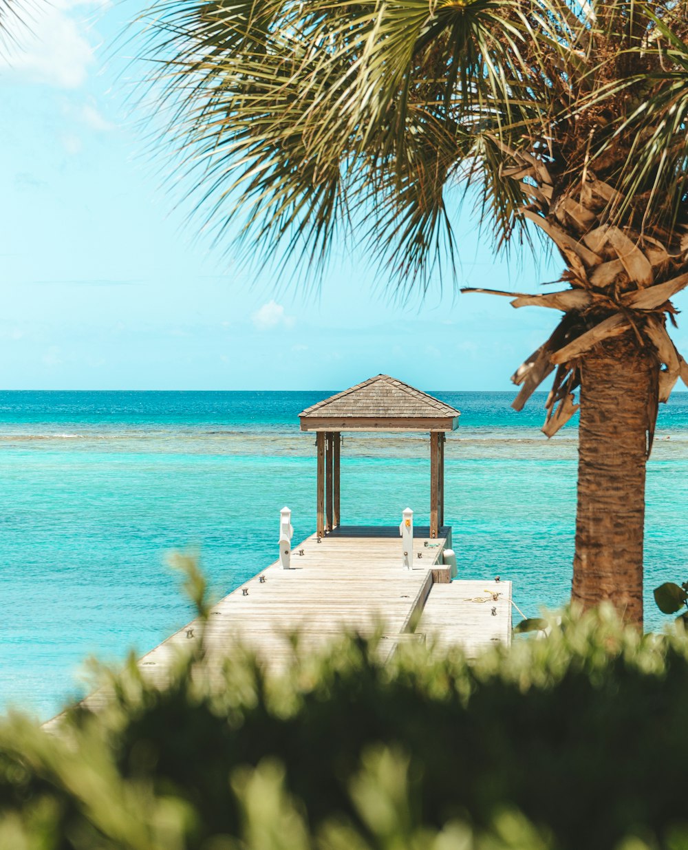 a dock leading to a beach