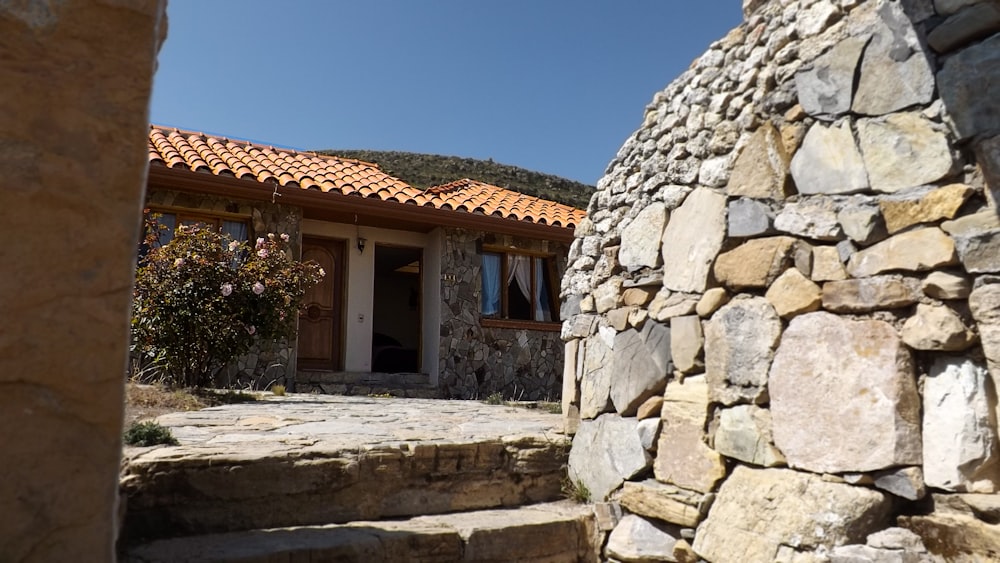 a stone building with a stone wall