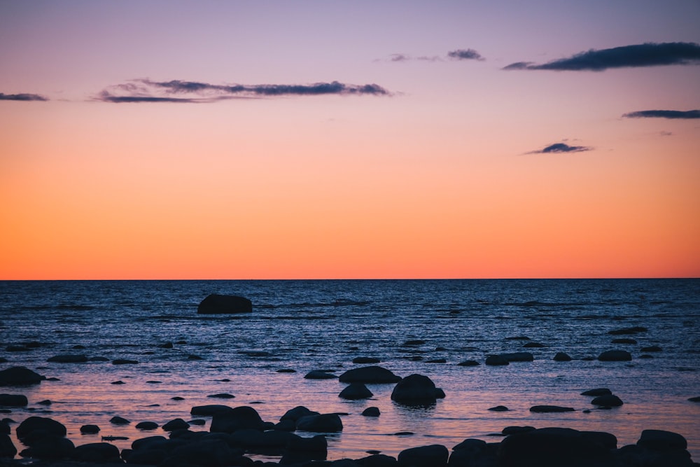 a beach with rocks and water