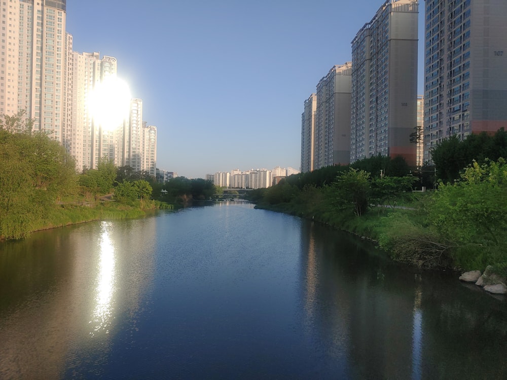 a river with tall buildings on either side of it